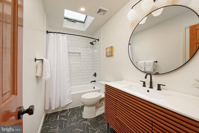  - full bathroom featuring a skylight, vanity, and shower / tub combo