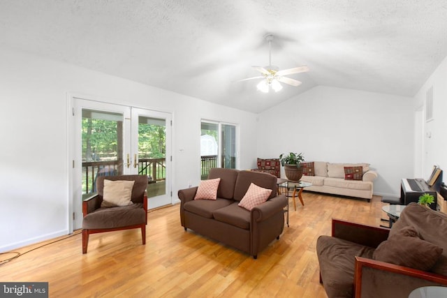 103 Patrick Henry Ct, Locust Grove, VA 22508 - living room with lofted ceiling, light wood-style flooring, a ceiling fan, and a textured ceiling