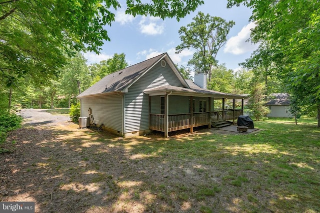 103 Patrick Henry Ct, Locust Grove, VA 22508 - rear view of property with crawl space, a chimney, a lawn, and roof with shingles