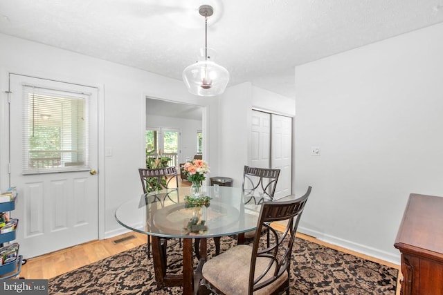 103 Patrick Henry Ct, Locust Grove, VA 22508 - dining space featuring light wood-style flooring and a textured ceiling