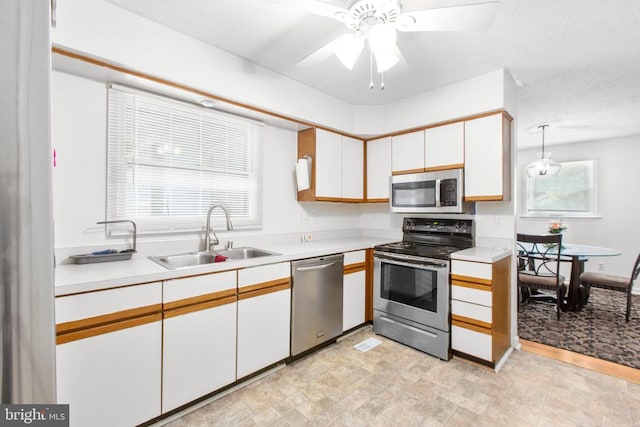103 Patrick Henry Ct, Locust Grove, VA 22508 - kitchen with appliances with stainless steel finishes, light countertops, white cabinets, and a ceiling fan