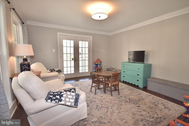  - living room featuring crown molding, french doors, healthy amount of natural light, and wood finished floors
