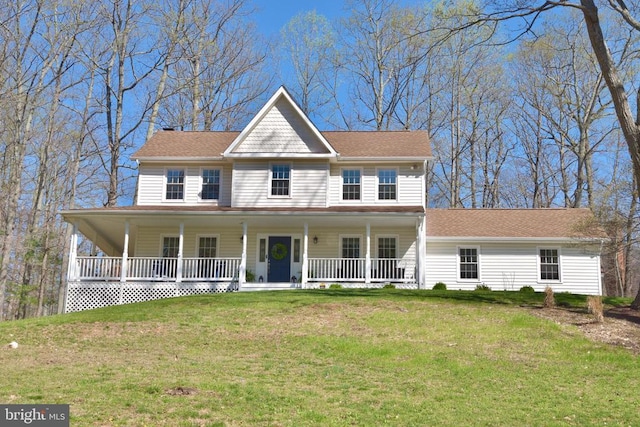 - view of front facade featuring a chimney, a front lawn, and a porch