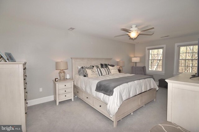 - bedroom featuring light colored carpet, baseboards, and ceiling fan