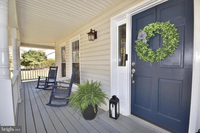  - wooden deck with a porch