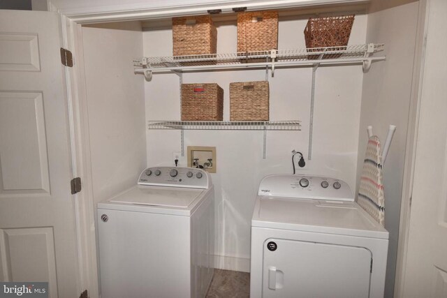  - clothes washing area featuring washer and clothes dryer
