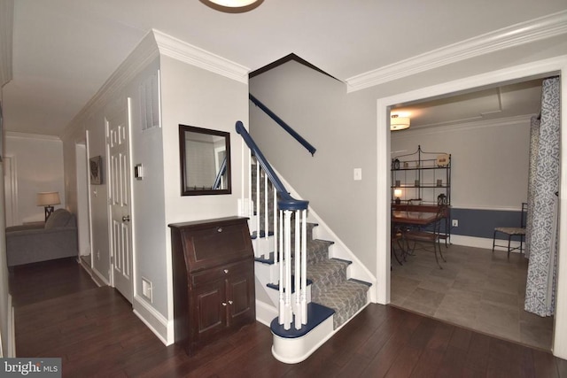 - stairway featuring wood-type flooring, baseboards, and crown molding