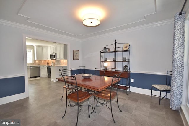  - dining room with ornamental molding and baseboards