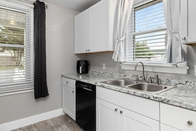 238 Charlotte Ave N, Waynesboro, VA 22980 - kitchen featuring black dishwasher, a sink, wood finished floors, white cabinets, and baseboards