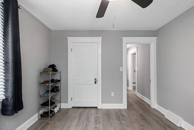 238 Charlotte Ave N, Waynesboro, VA 22980 - bedroom featuring wood finished floors, a textured ceiling, baseboards, and a ceiling fan