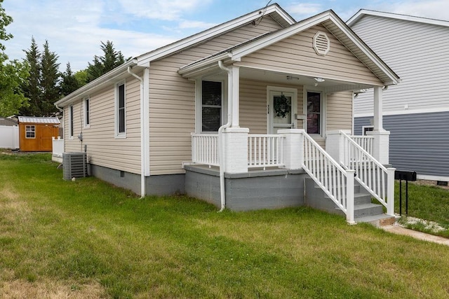 238 Charlotte Ave N, Waynesboro, VA 22980 - view of front of home featuring crawl space, central air condition unit, a front yard, a storage shed, and an outbuilding
