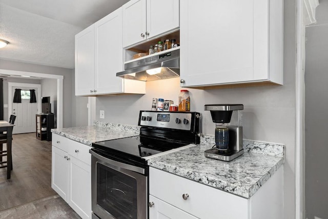238 Charlotte Ave N, Waynesboro, VA 22980 - kitchen with stainless steel electric stove, under cabinet range hood, white cabinetry, light wood finished floors, and open shelves