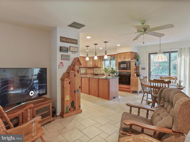  - living room featuring ceiling fan and recessed lighting