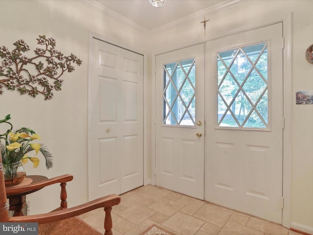  - entrance foyer with light stone finish flooring and ornamental molding