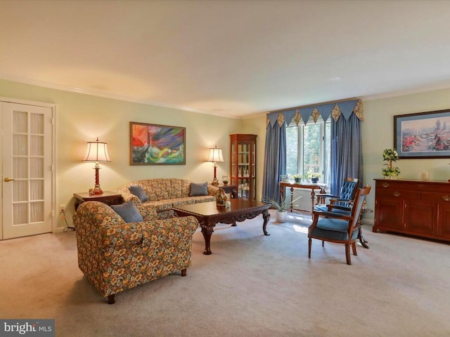  - living room featuring light carpet and ornamental molding