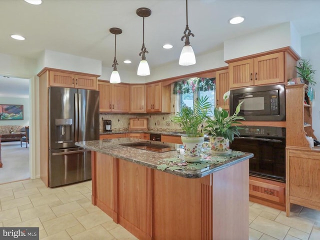  - kitchen with black appliances, dark stone countertops, a kitchen island, pendant lighting, and decorative backsplash