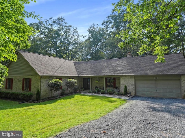  - single story home with brick siding, driveway, a garage, and a front yard