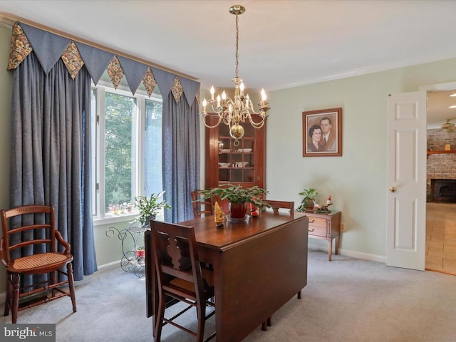  - dining area with a chandelier, light colored carpet, healthy amount of natural light, and ornamental molding