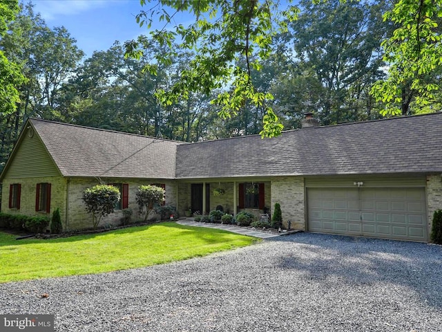  - ranch-style house featuring gravel driveway, brick siding, a garage, a front lawn, and a shingled roof