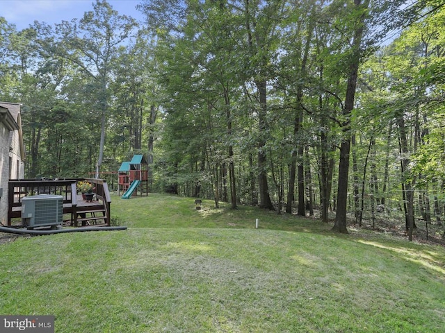  - view of green lawn featuring a playground