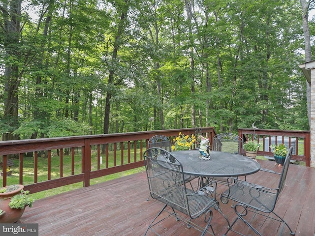  - wooden deck featuring outdoor dining area