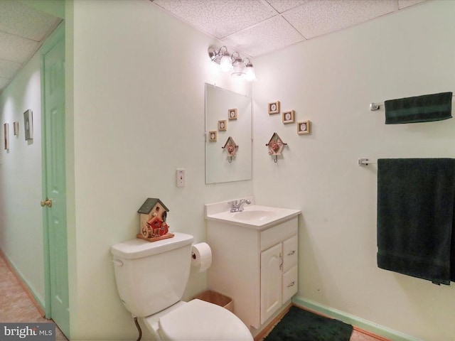  - bathroom featuring a drop ceiling and vanity
