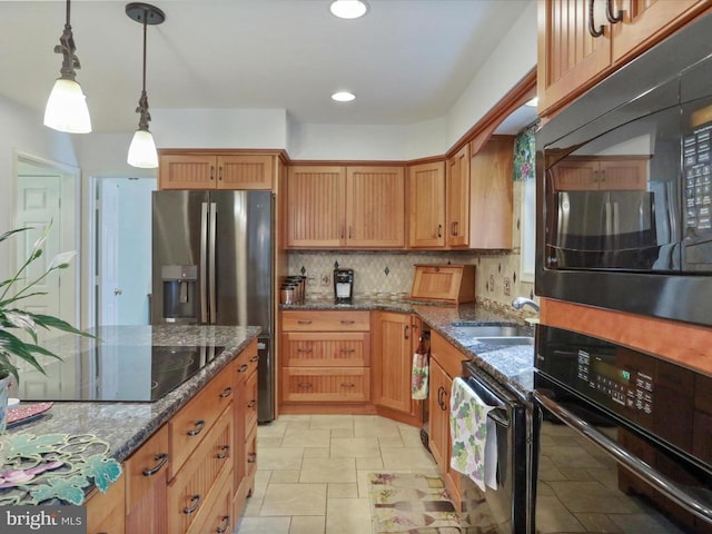  - kitchen with black appliances, decorative backsplash, hanging light fixtures, dark stone counters, and brown cabinets