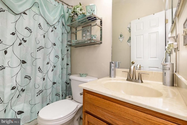 full bathroom with vanity, toilet, and curtained shower