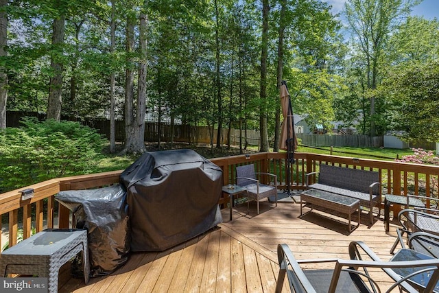 wooden terrace with a grill