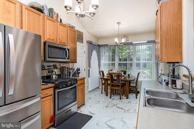 kitchen featuring stainless steel appliances, a chandelier, a sink, light marble finish flooring, and decorative light fixtures
