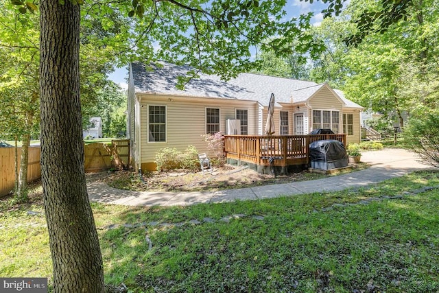 back of property with a deck