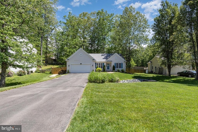 view of front facade with an attached garage and asphalt driveway