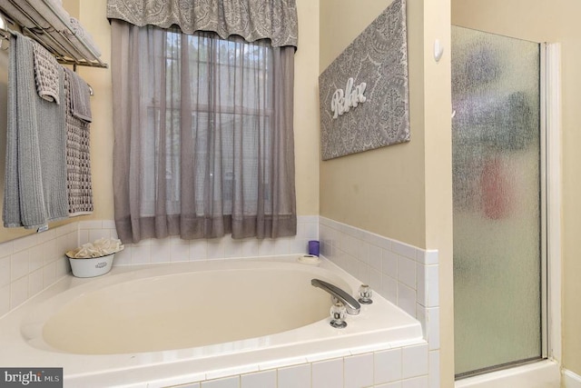 full bath with a shower stall and a bath