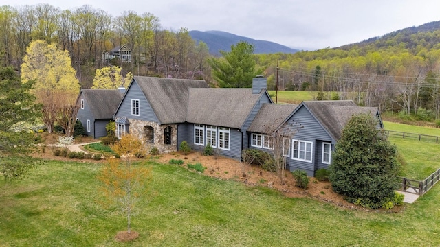 27 Black Walnut Ln, Nellysford, VA 22958 - view of front facade featuring a chimney, stone siding, a forest view, and a mountain view
