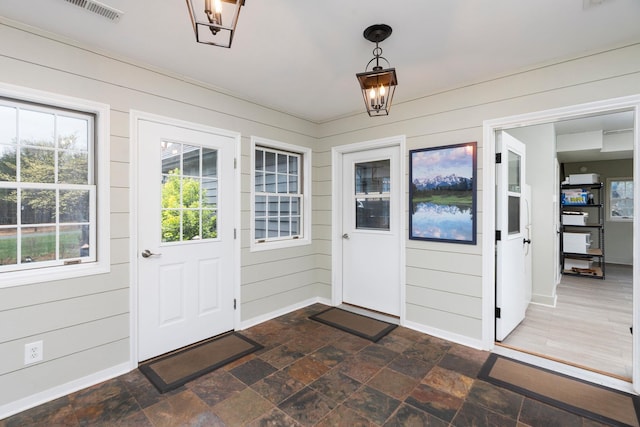 27 Black Walnut Ln, Nellysford, VA 22958 - foyer featuring baseboards, wooden walls, and dark stone finish flooring