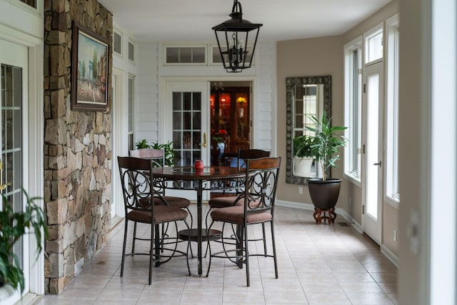 27 Black Walnut Ln, Nellysford, VA 22958 - dining area with french doors, light tile patterned floors, and baseboards