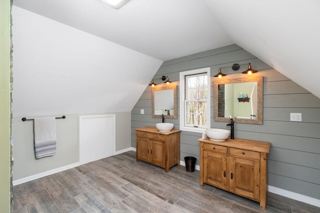 27 Black Walnut Ln, Nellysford, VA 22958 - bonus room featuring a sink, vaulted ceiling, wood finished floors, wood walls, and baseboards