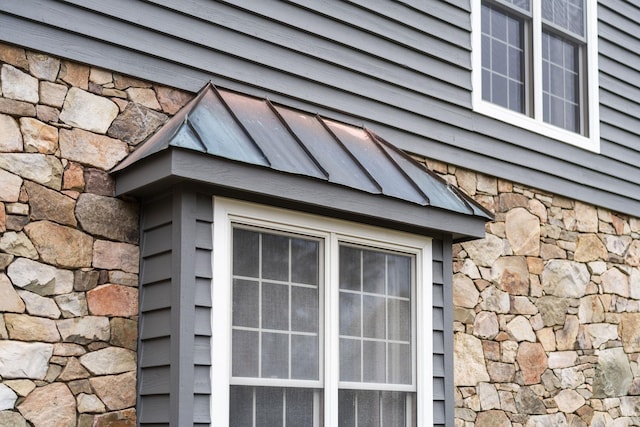 27 Black Walnut Ln, Nellysford, VA 22958 - exterior view of stone siding, a standing seam roof, and metal roof