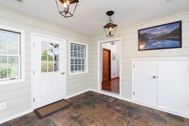 27 Black Walnut Ln, Nellysford, VA 22958 - entrance foyer featuring dark stone finish floors and wood walls