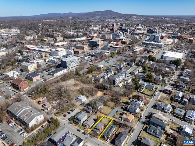 birds eye view of property with a view of city and a mountain view