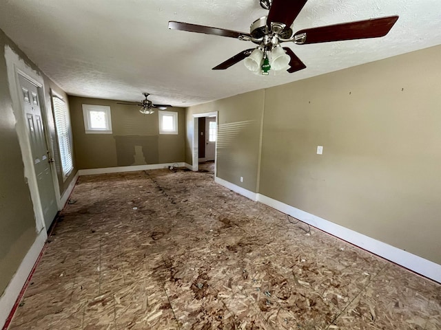 1112 Butler St, Staunton, VA 24401 - unfurnished living room featuring baseboards and a ceiling fan