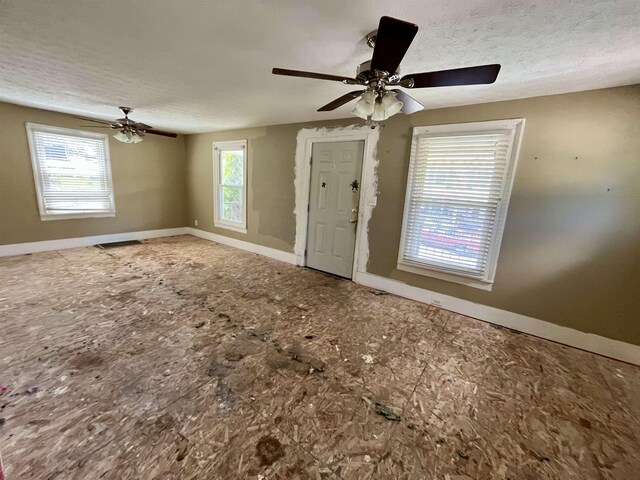 1112 Butler St, Staunton, VA 24401 - foyer with baseboards, a ceiling fan, and a textured ceiling