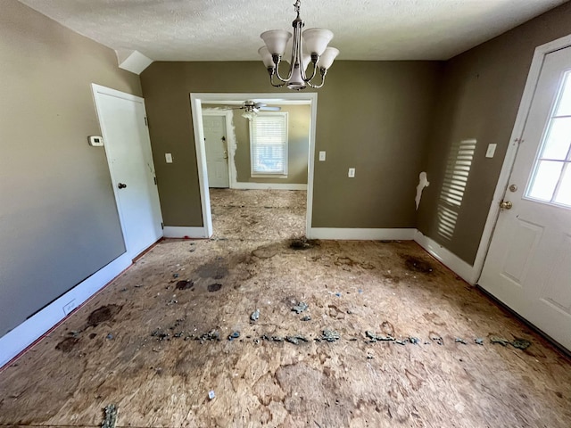 1112 Butler St, Staunton, VA 24401 - unfurnished dining area featuring a chandelier, baseboards, a textured ceiling, and ceiling fan