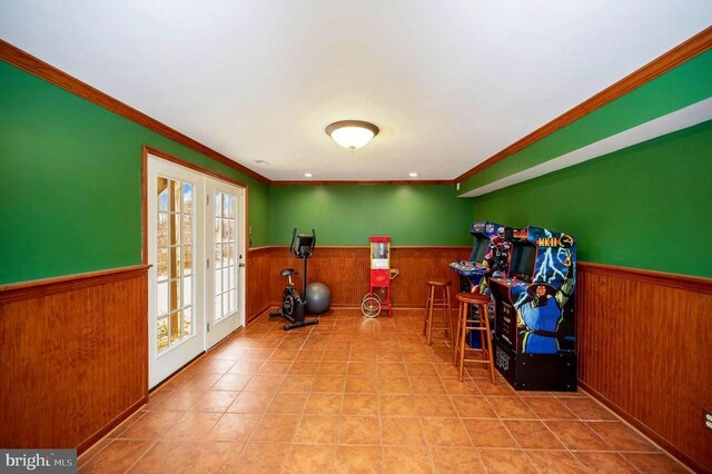 9920 Post Oak Rd, Spotsylvania, VA 22551 - exercise area featuring wainscoting, ornamental molding, wood walls, and french doors