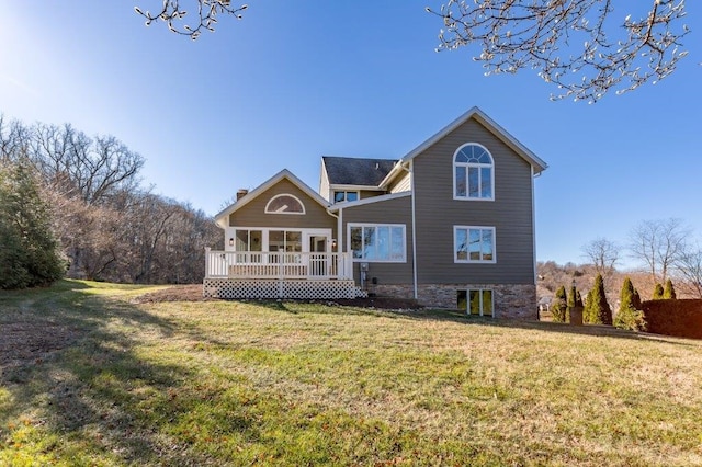 back of property featuring a porch and a lawn