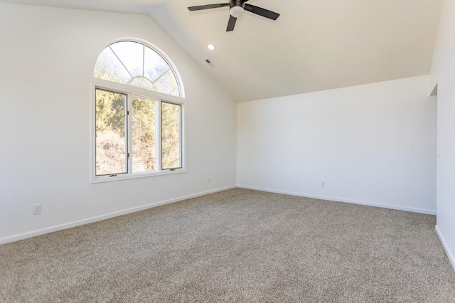 interior space with lofted ceiling, carpet floors, and ceiling fan