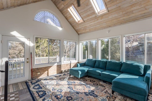 sunroom / solarium featuring vaulted ceiling with skylight and wooden ceiling