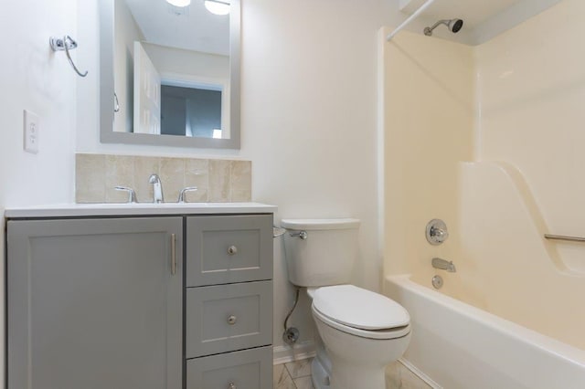 full bathroom featuring vanity, decorative backsplash, shower / bathtub combination, and toilet