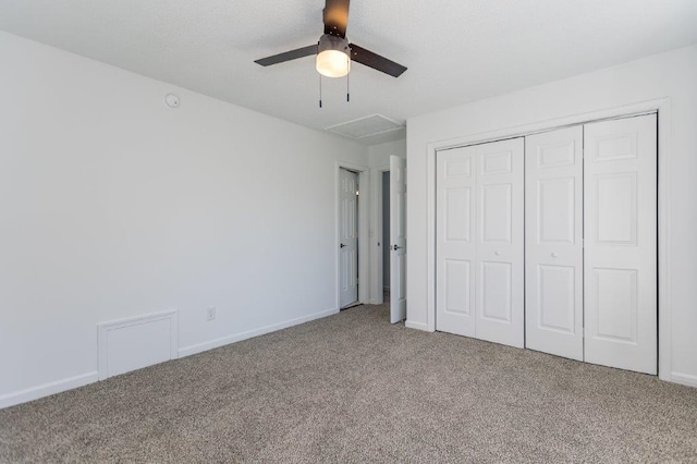 unfurnished bedroom with ceiling fan, a closet, and carpet