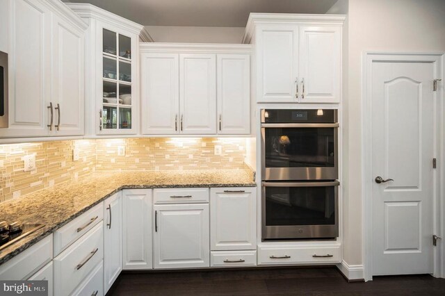 9822 White Oak Swamp Ct, Fredericksburg, VA 22407 - kitchen with stainless steel double oven, white cabinetry, tasteful backsplash, and glass insert cabinets